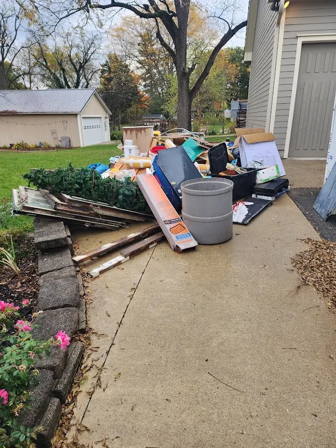 Dumpster being loaded with debris for Residential Dumpster Rental in Wareham